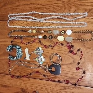 9 piece costume jewelry lot, blues, pinks, and gold and silver.